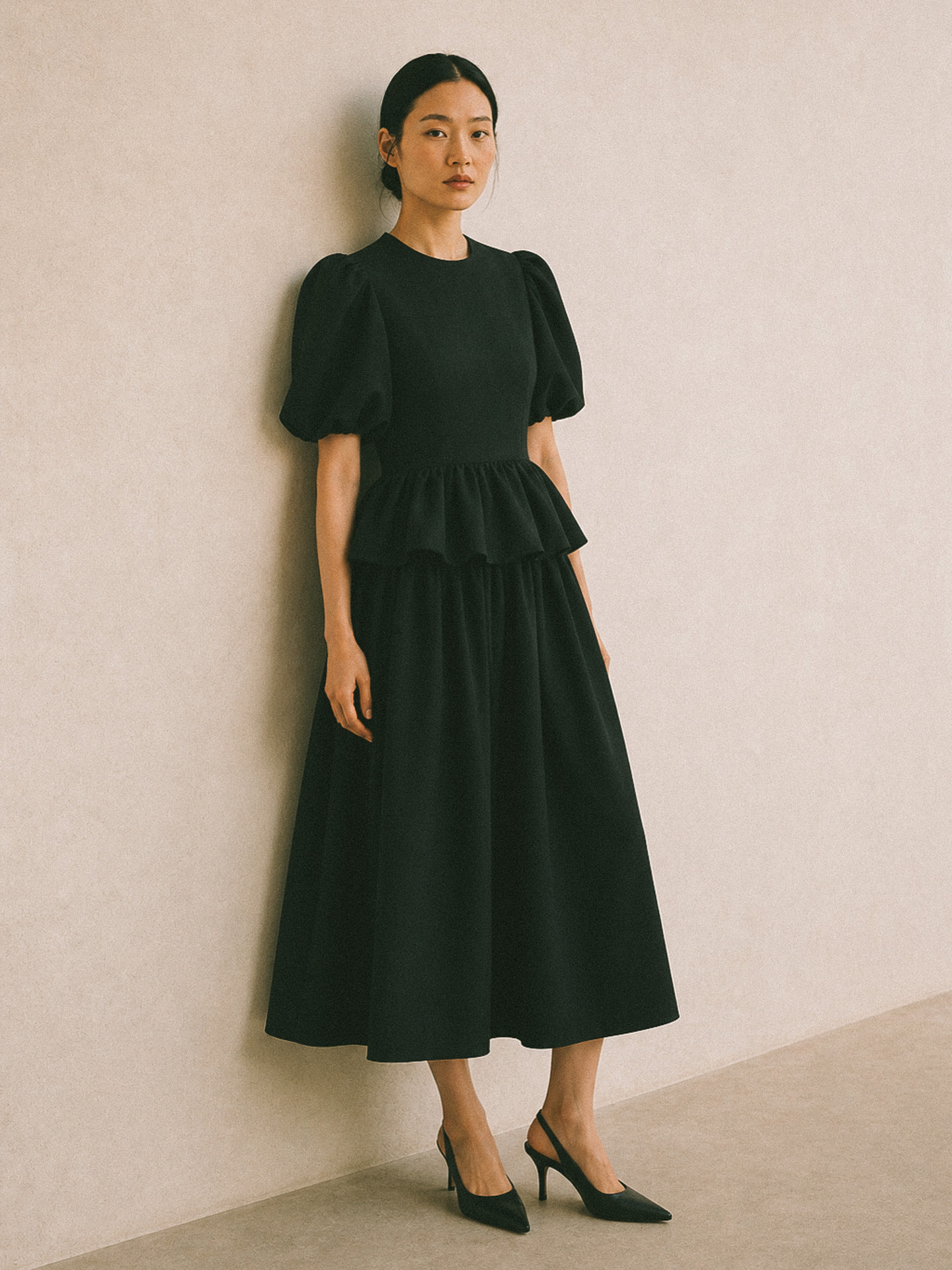 Womenswear uniform dress in black, worn full length