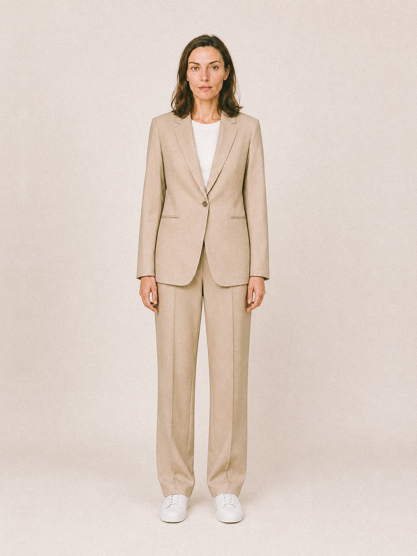 Womenswear uniform — oatmeal single-breasted suit over a white tee