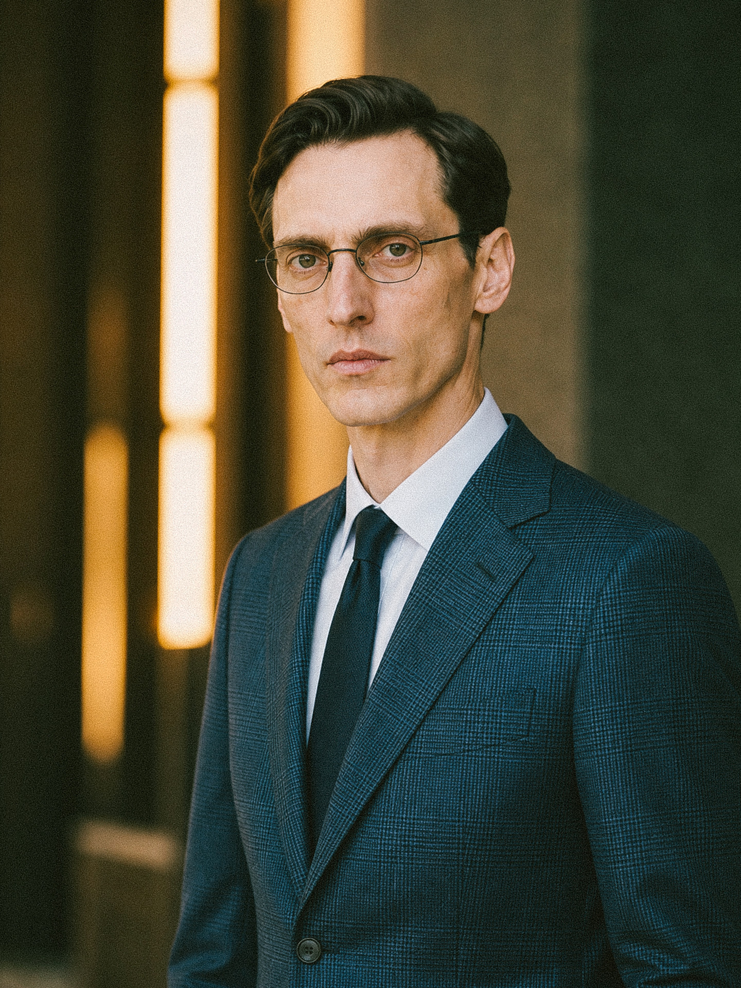 Menswear checked jacket with a white shirt and tie, close