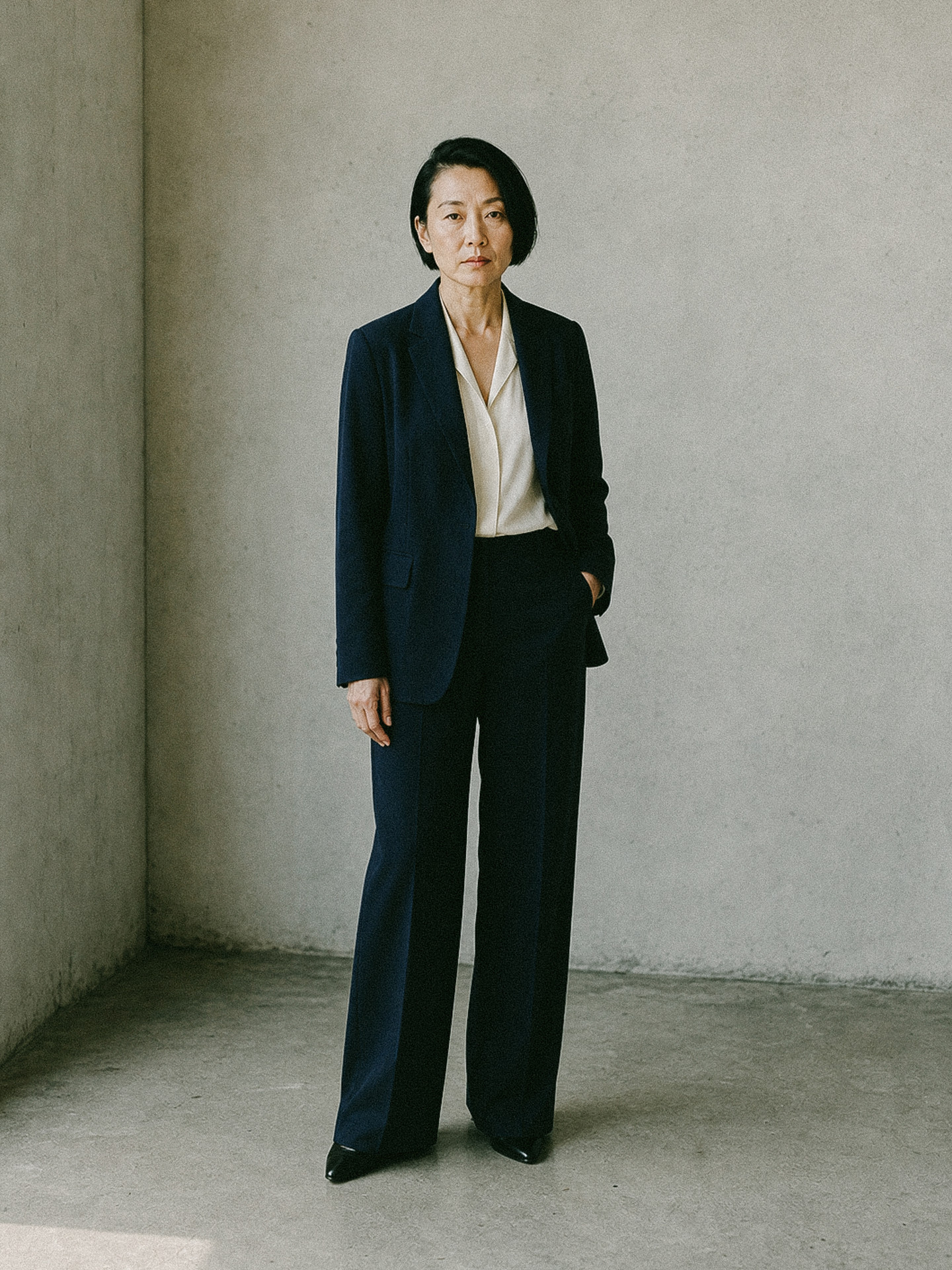 Navy suit with a white shirt, worn full length